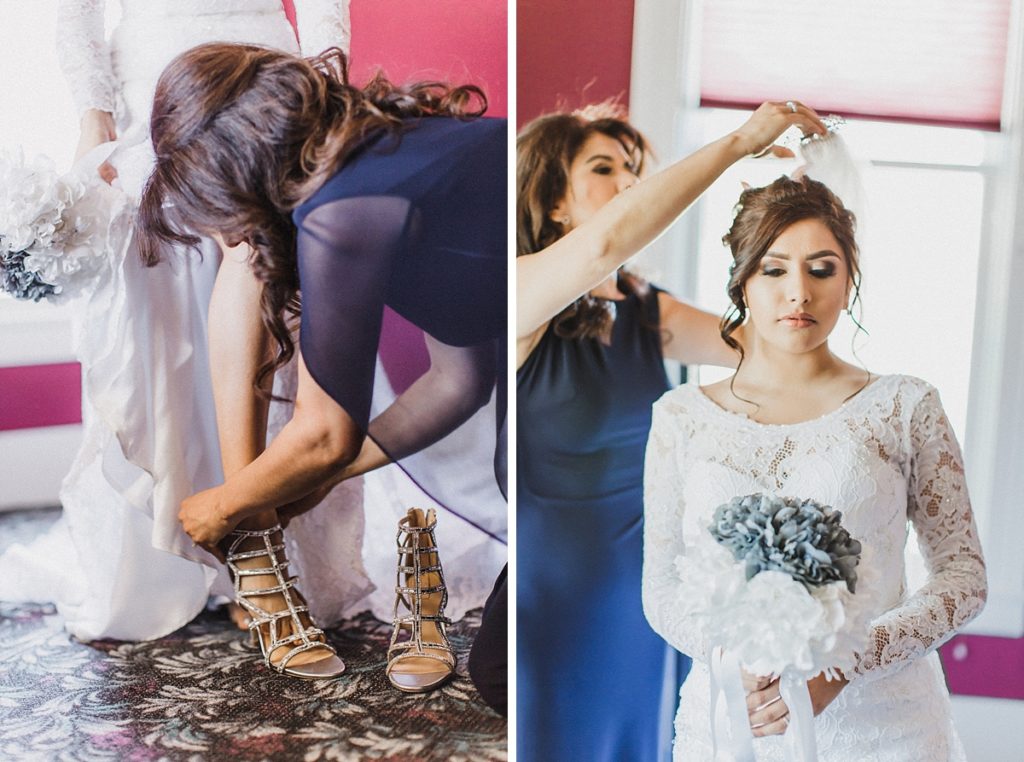 mother of bride puts shoes and veil on bride