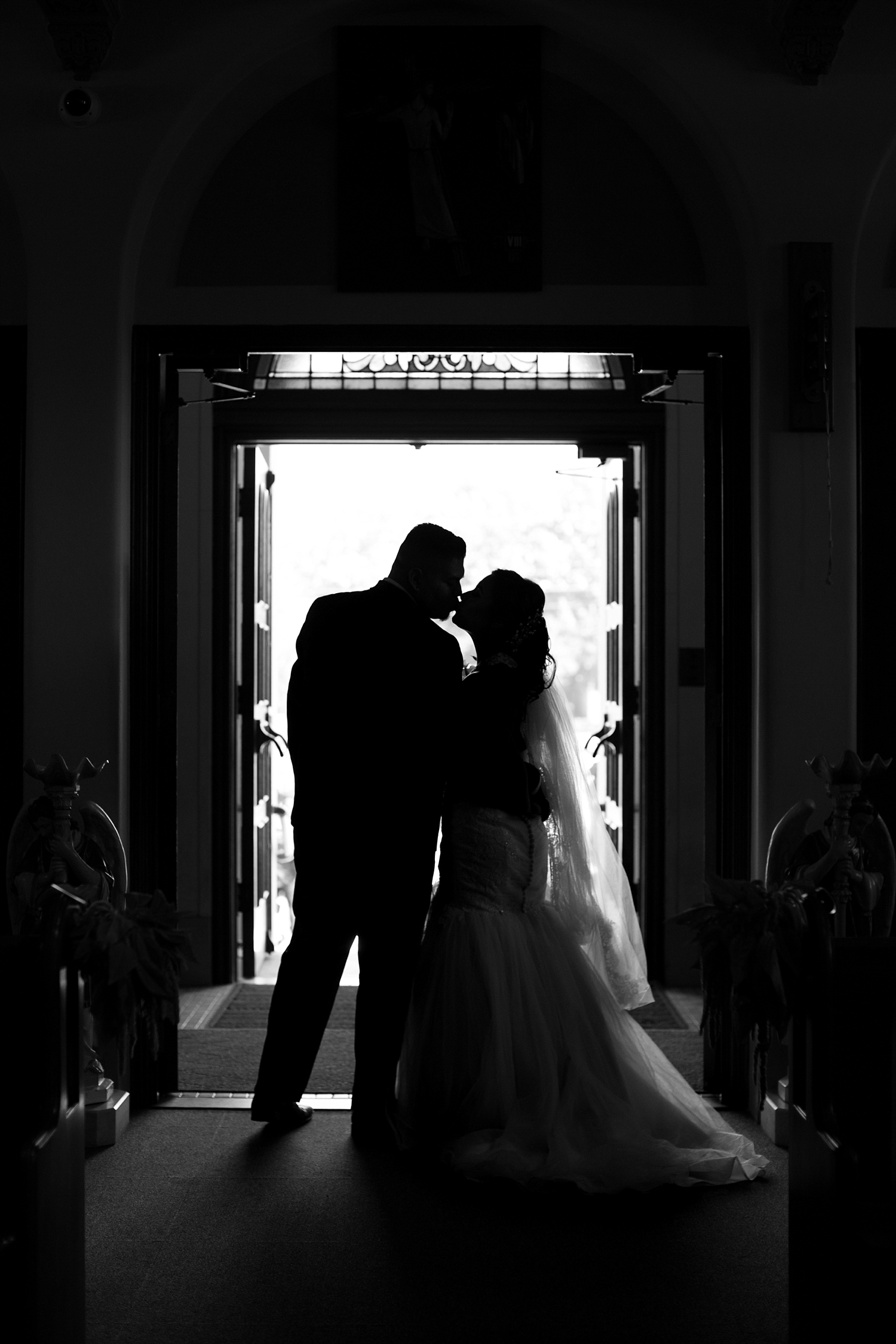doorway kiss at wedding