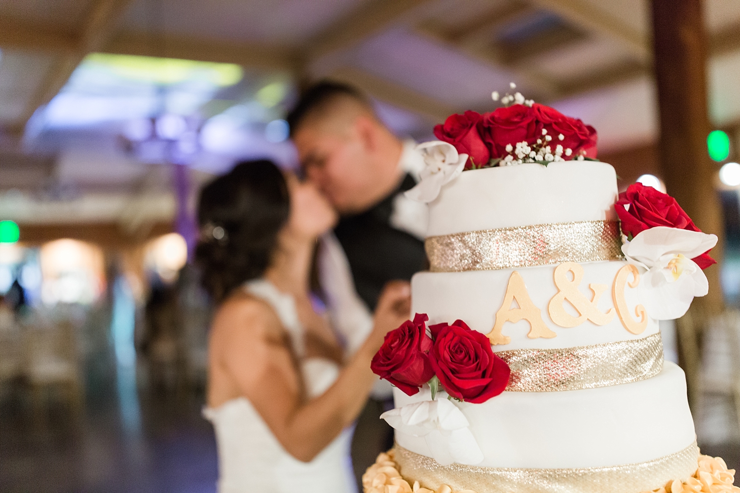 newlyweds cut wedding cake at Heritage Hall