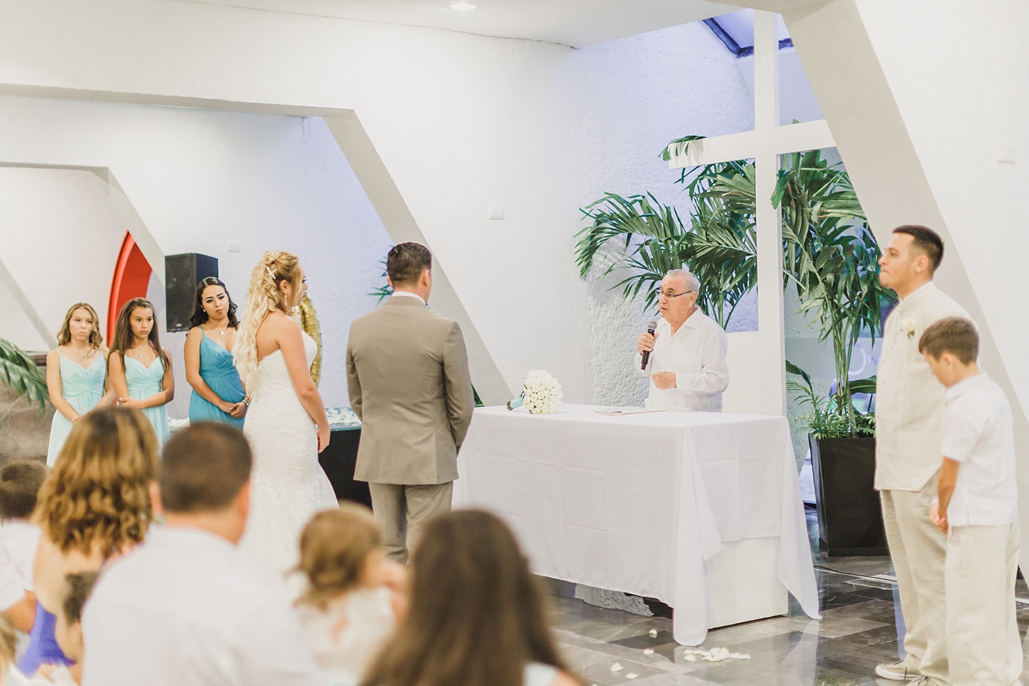 bride and groom at altar in Cancun wedding
