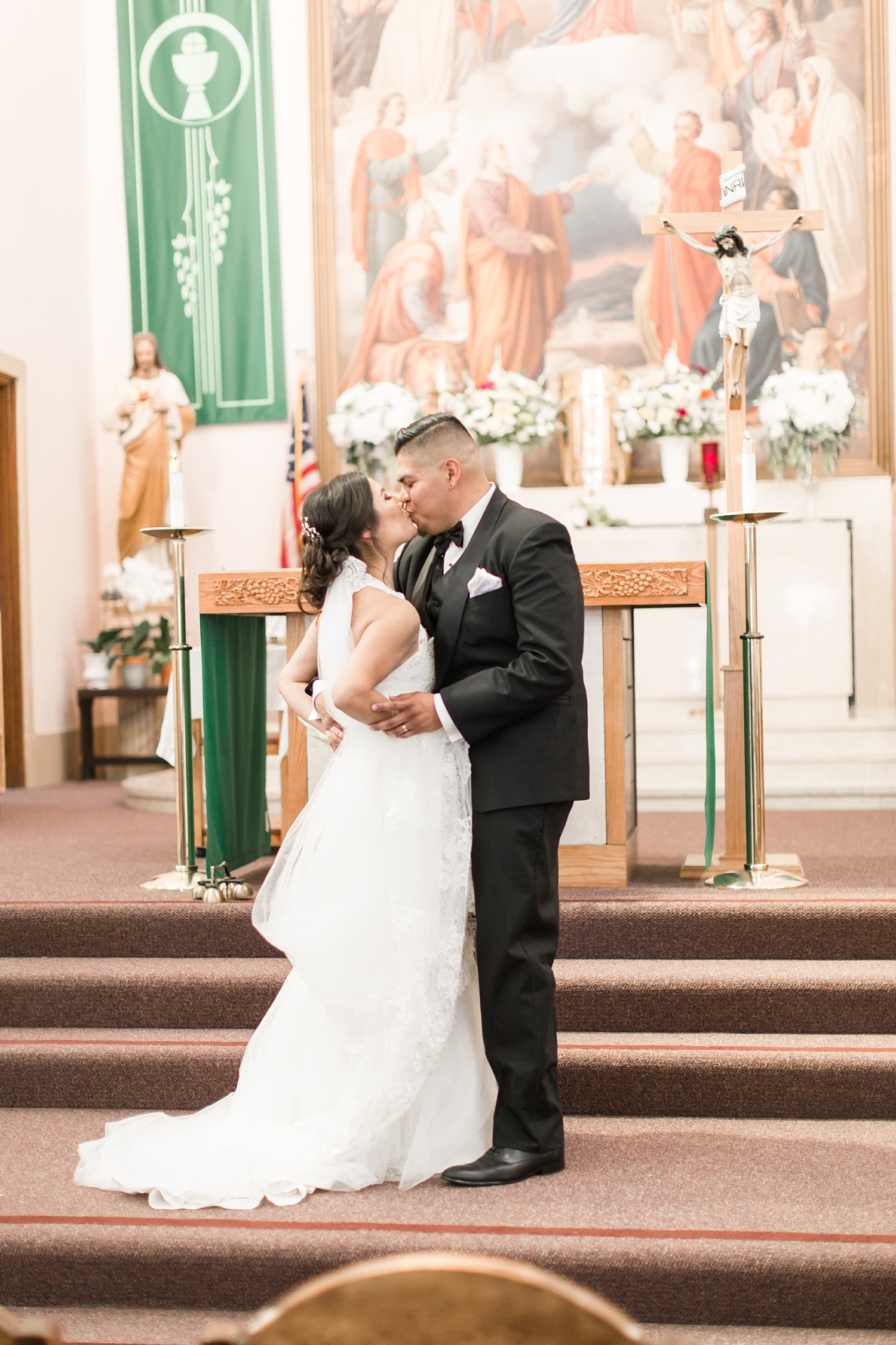 newlywed kiss at Our Lady Help of Christians