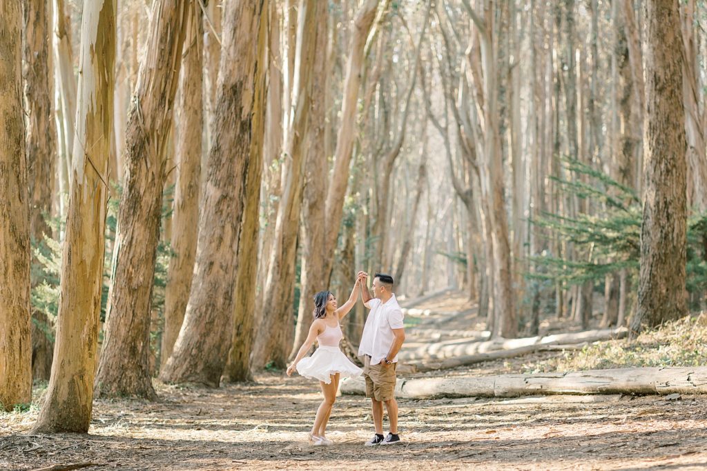 engagement session in Lovers Lane, couple twirling